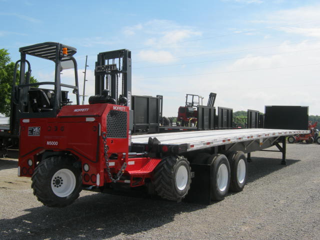 Flatbed Trailer With Moffett Forklift On Back